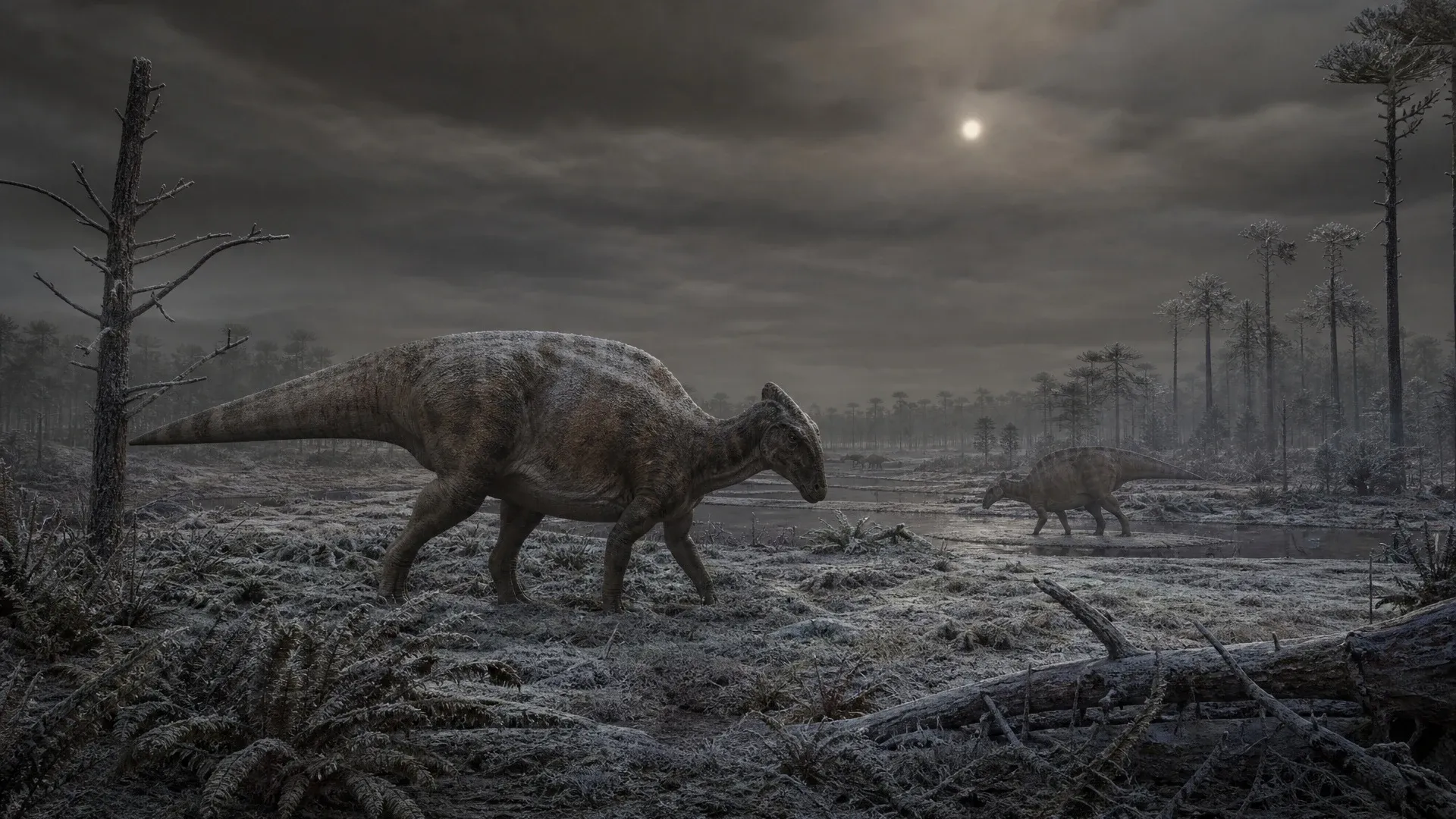 A dinosaur walks through a cold grey landscape beneath a sky darkened by suspended impact material.